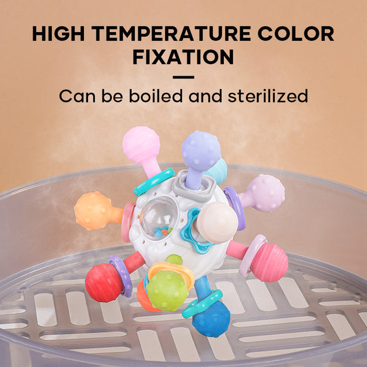 Close-up of baby teether and rattle with textured surfaces for sensory development, non-toxic