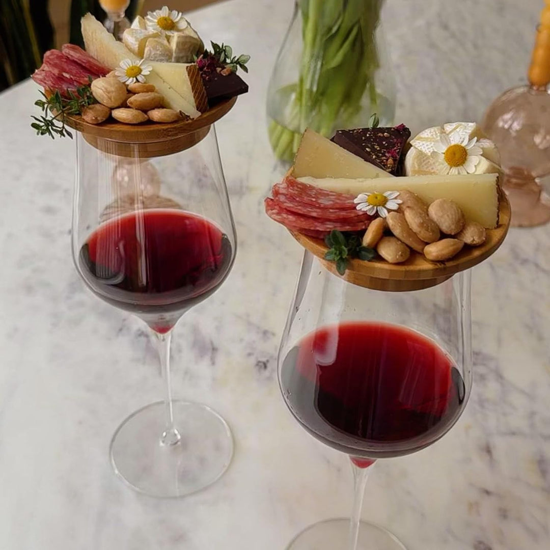 Portable bamboo charcuterie board, designed to sit atop a wine glass for hands-free enjoyment