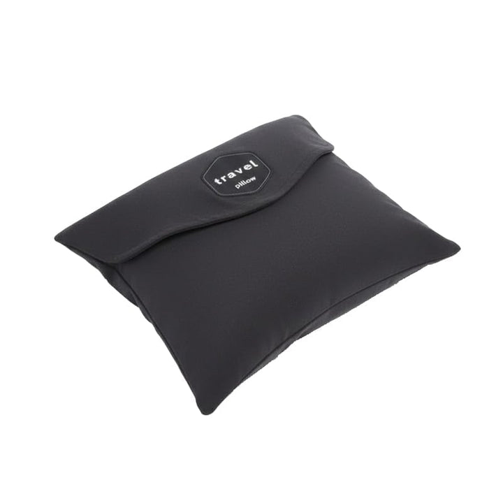 Traveler resting comfortably with a gray ergonomic travel neck pillow, demonstrating its effective neck support.