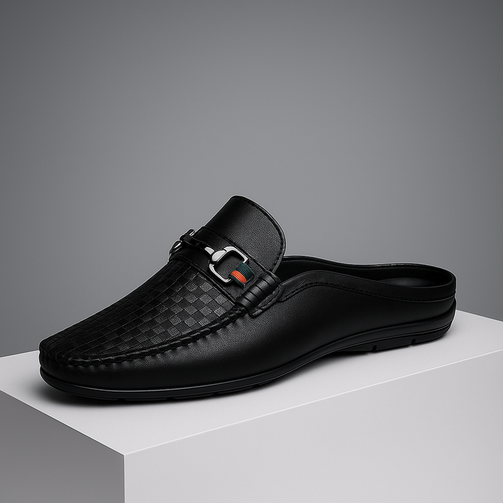 White perforated leather mules for women with a stylish metal bit, offering comfort and breathability.