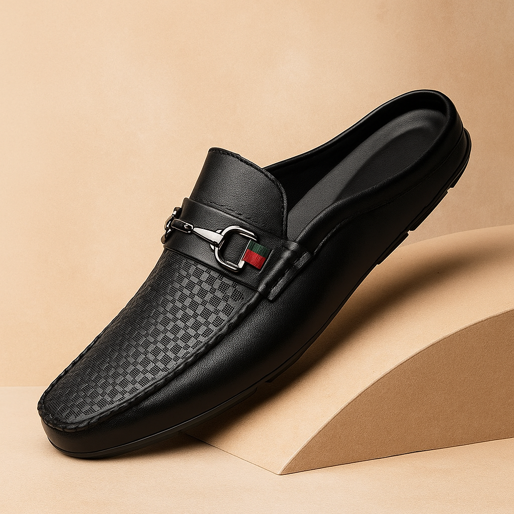 Elegant white leather mules for women, slip-on style with intricate perforation and a chic metal bit accent.