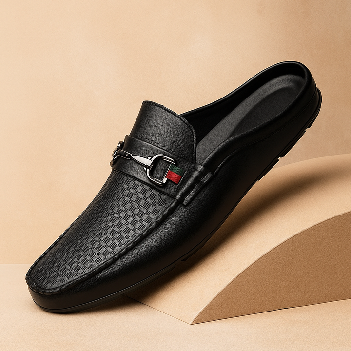 Elegant white leather mules for women, slip-on style with intricate perforation and a chic metal bit accent.