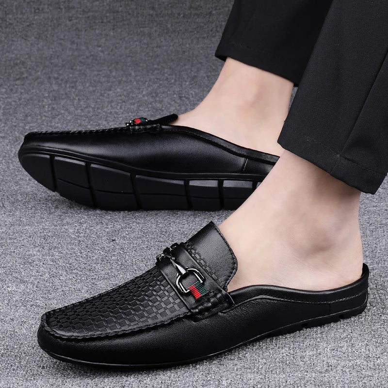 Comfortable women's black leather dress mules, slip-on design with a distinctive metal bit.