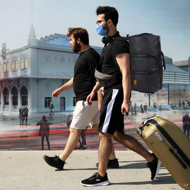 Professional black garment duffel bag, ready for business trips, keeping suits wrinkle-free. Organized luggage.