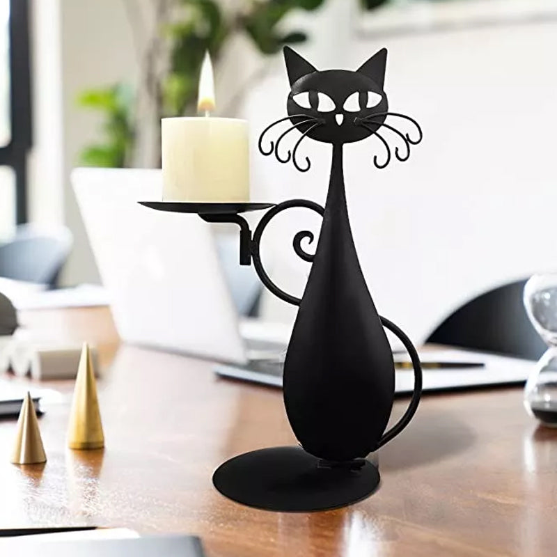 Close-up of a black metal cat candle holder, showcasing intricate craftsmanship.