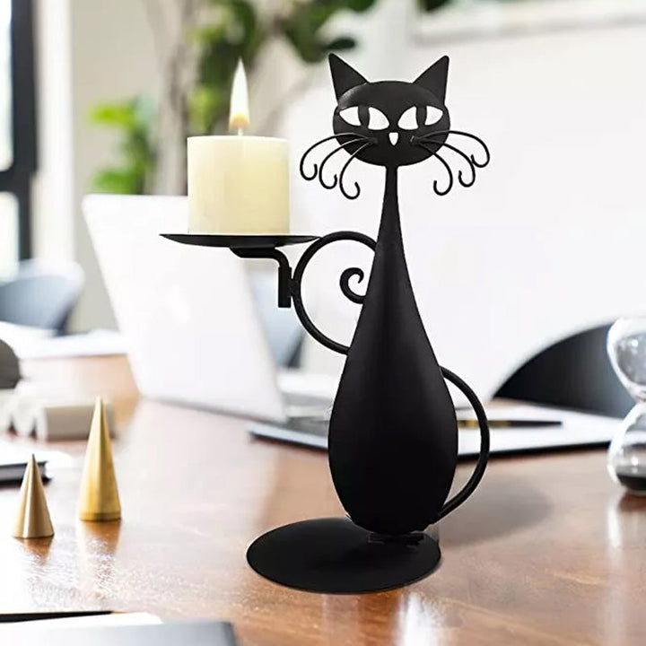 Close-up of a black metal cat candle holder, showcasing intricate craftsmanship.