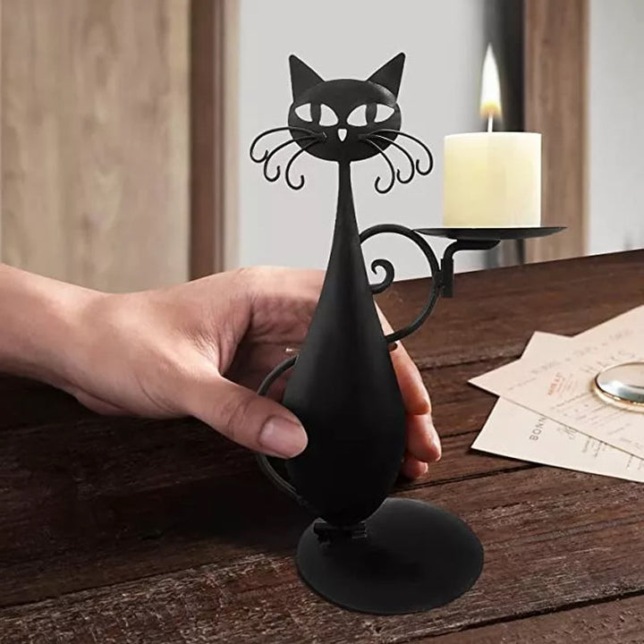 Handcrafted black metal cat candle holder, bringing charm to your tabletop.