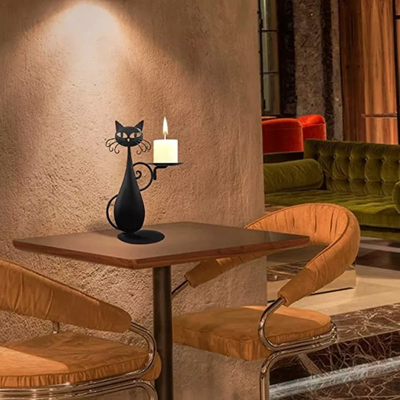 Whimsical cat candle holder in black metal, a perfect cat decor piece.