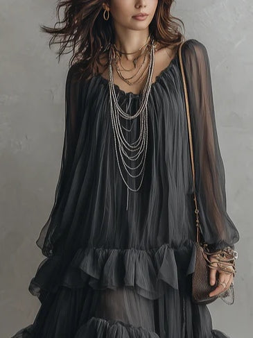 Flowy black tiered maxi dress with V-neck, a chic women's party or casual summer dress. Ruffle details.