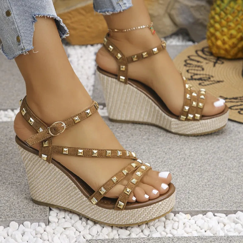 Side view of women's brown wedge sandals with platform sole and stud accents, comfortable fit