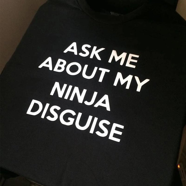 Casual grey t-shirt for men and women, showcasing a funny flip-up ninja graphic.