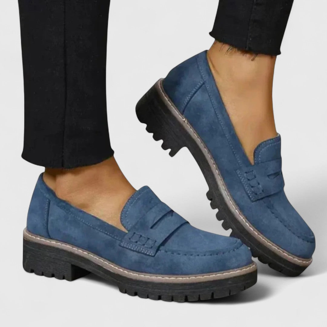 Comfortable blue orthopedic women's loafers offering foot & arch support. Slip-on design for easy daily wear & walking.