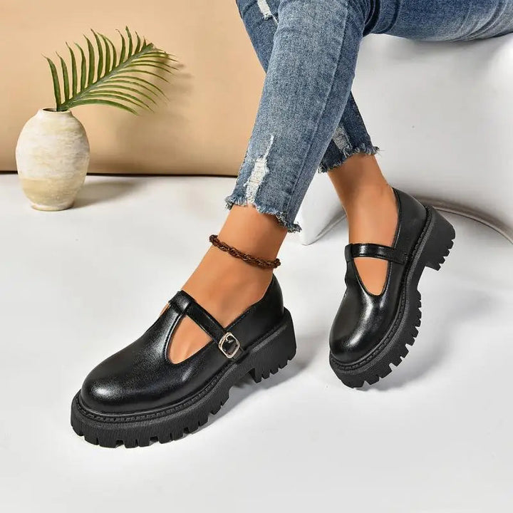 Women's black platform Mary Jane heels with orthopedic support and comfortable design.