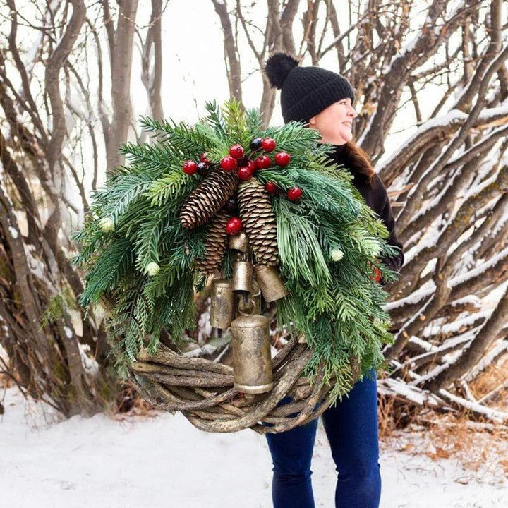 Bohemian Christmas wreath with dried florals, pinecones, & berries. Perfect holiday front door decor.