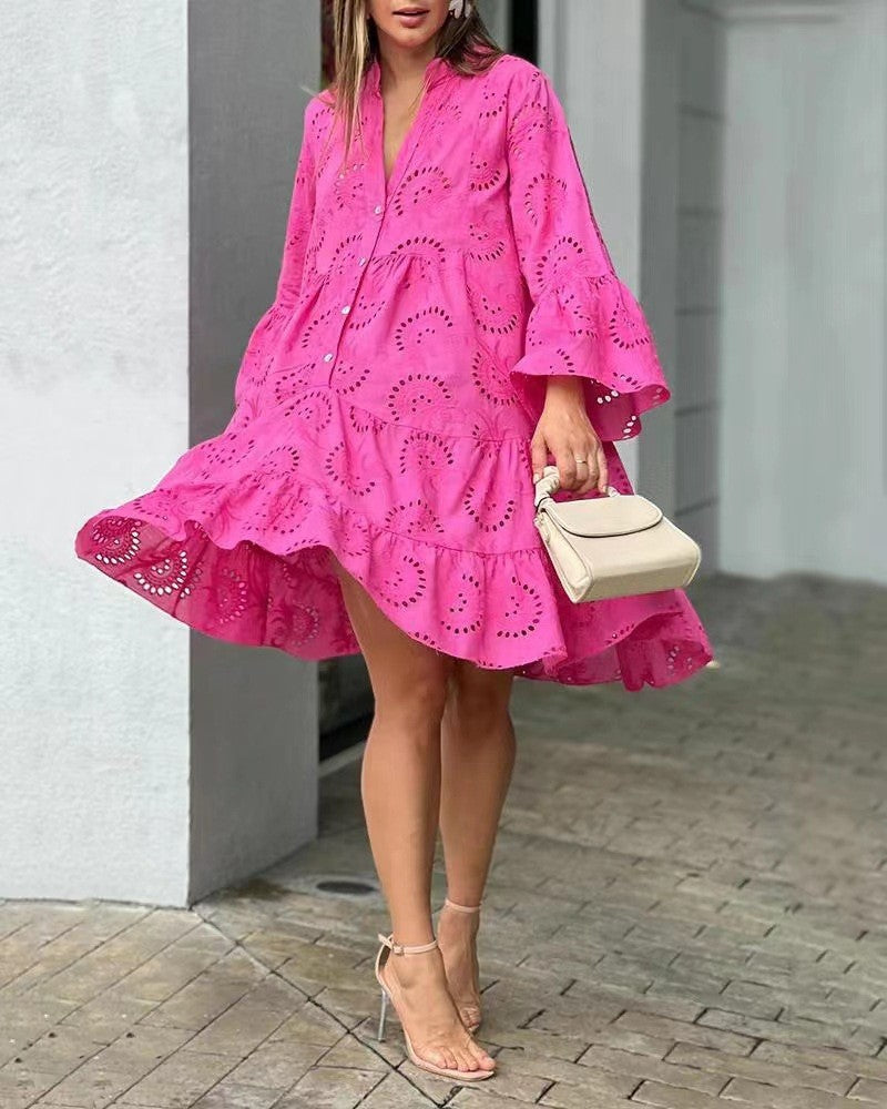 Bohemian women's embroidered tiered mini dress with V-neck & bell sleeves. Ideal for summer casual wear.