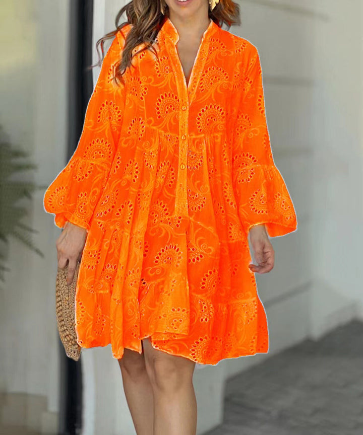Chic women's embroidered tiered mini dress. Features V-neck, bell sleeves & button front, ideal for summer fashion.