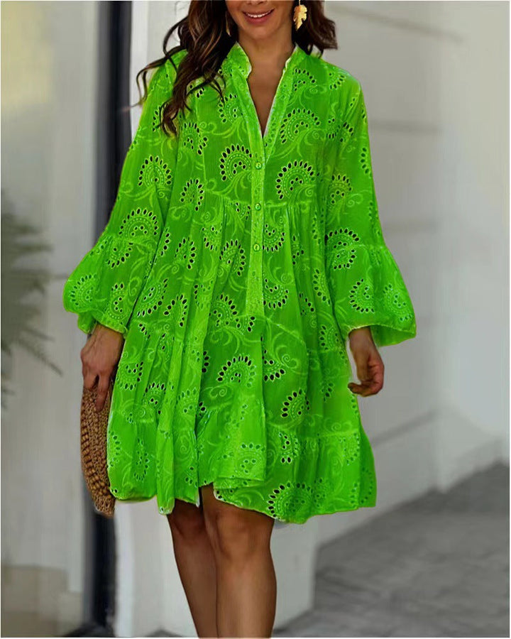 Casual women's embroidered tiered mini dress, perfect for summer. Bohemian style with a V-neck and bell sleeves.