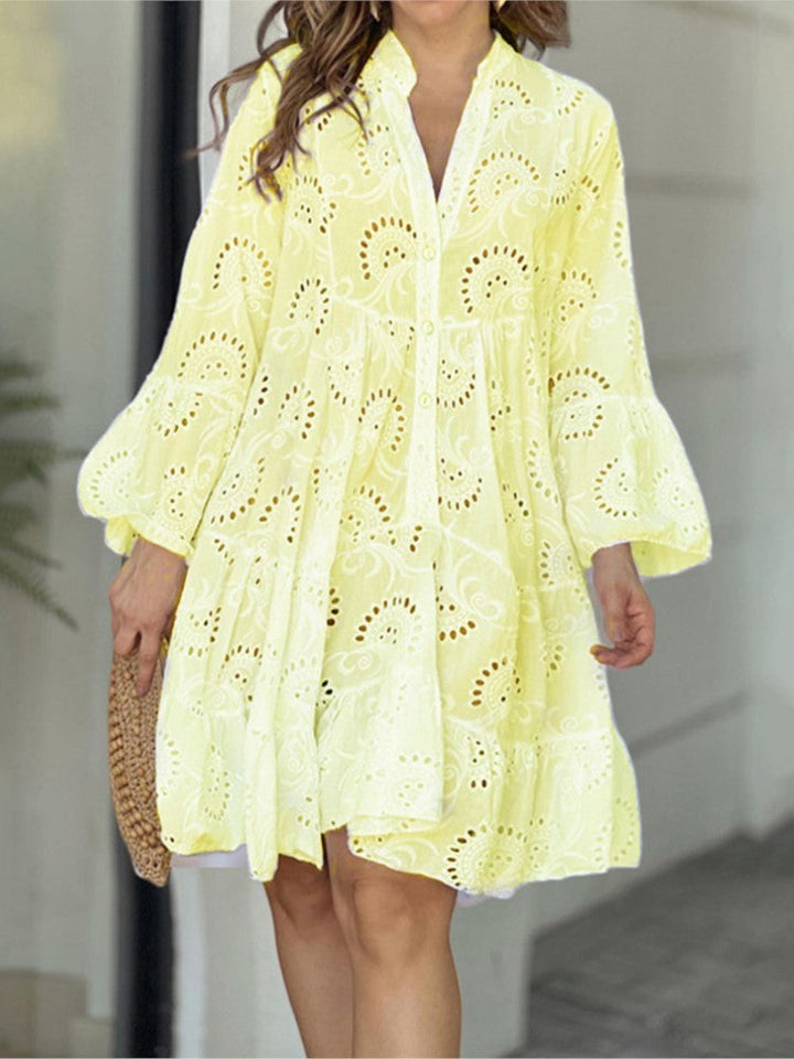 Stylish women's embroidered tiered mini dress. V-neck, bell sleeves, A-line shape. Perfect casual summer party dress.
