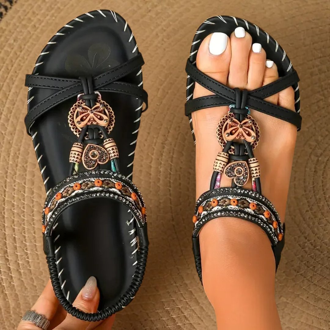 Orthopedic women's sandals, flat t-strap design, offering comfort and support for daily boho summer outfits.