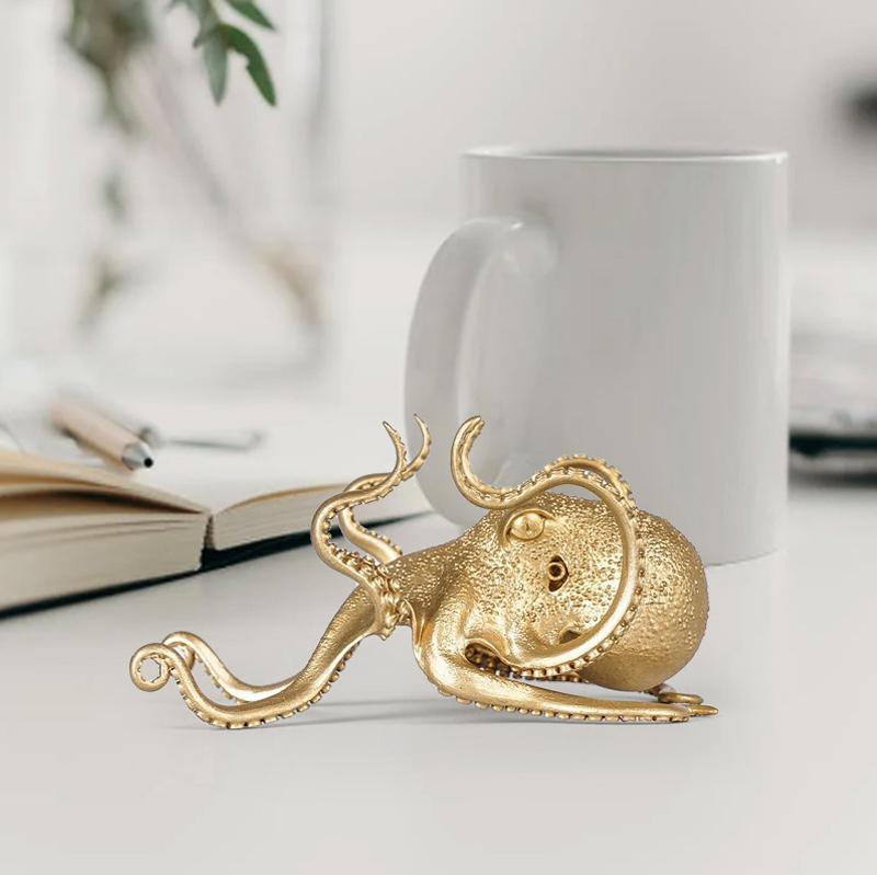 Artistic brass octopus phone stand, a conversation piece for any office or home desktop