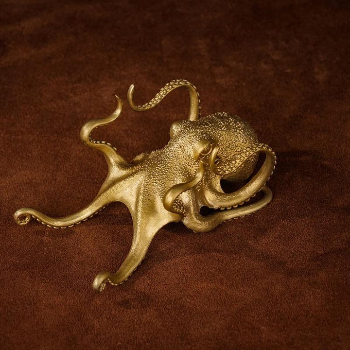 Desktop decor: brass octopus phone holder, a stylish and functional animal sculpture