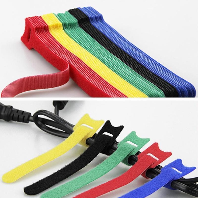 Organized messy drawer with multipurpose cable ties, showcasing effective cord management solutions.