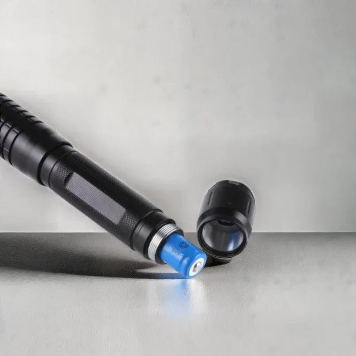 Durable blue tactical laser, perfect for outdoor survival, starting fires, and emergency signaling.