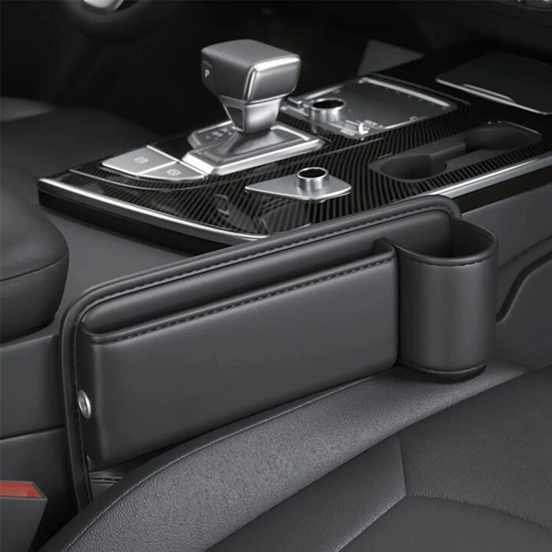 Automotive seat gap storage box with integrated charging cable for smartphones and devices