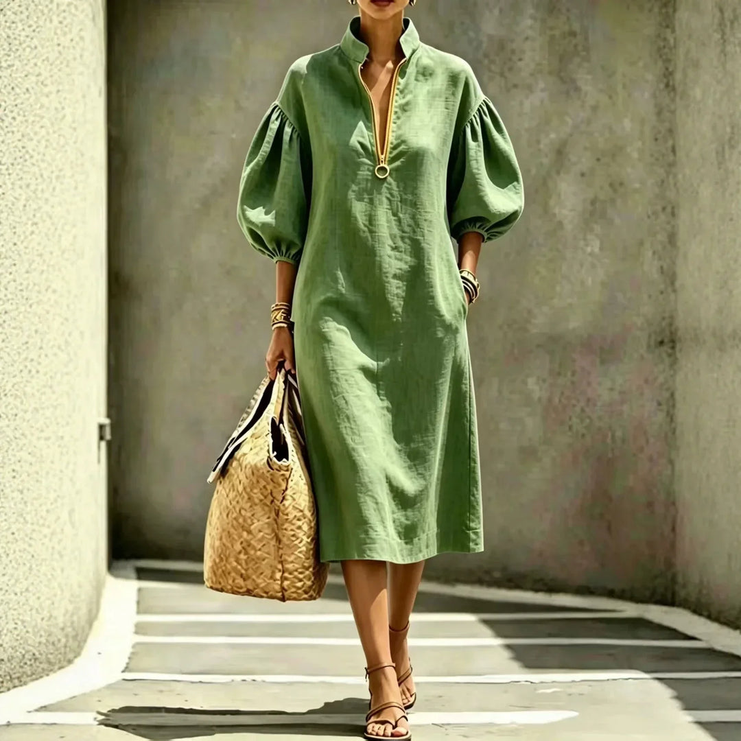 Stylish women's midi dress with fashionable bubble sleeves, half-zip, and stand collar. Ideal for modern casual chic outfits.