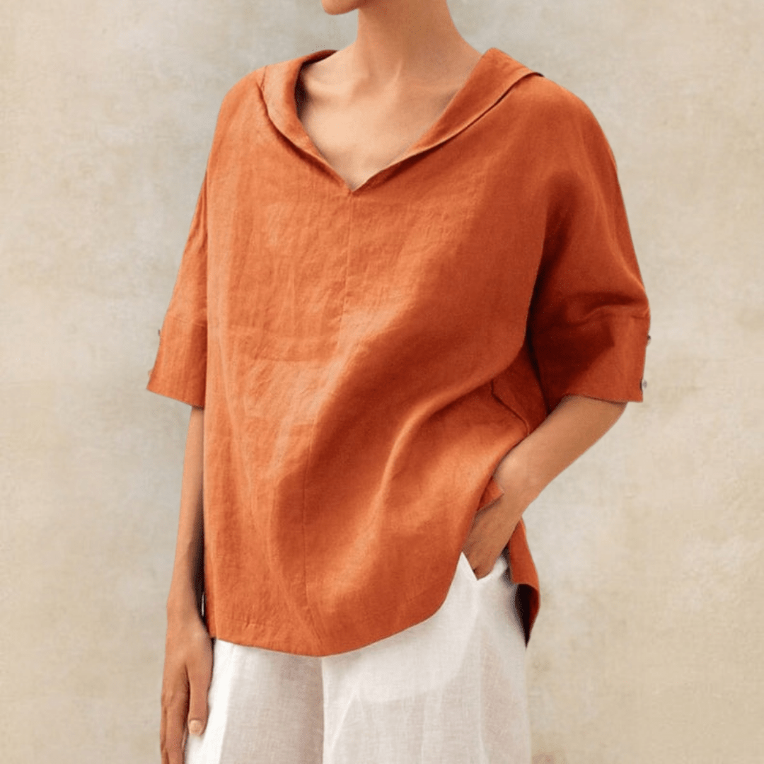 Oversized green women's collared V-neck tunic top with short sleeves, ideal for versatile casual wear.