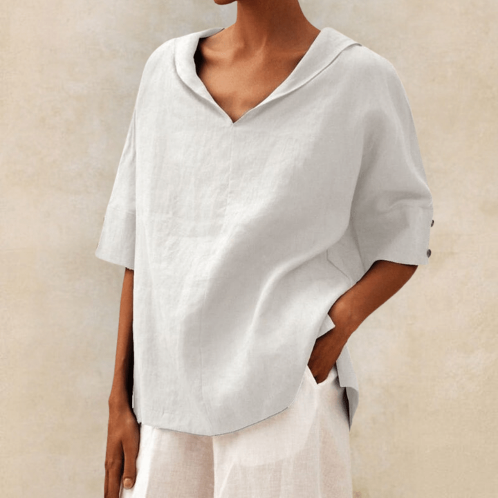 Relaxed white women's collared V-neck tunic blouse with short sleeves, perfect for summer casual outfits.