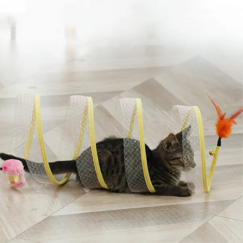 Playful cat inside a blue interactive tunnel, batting at hanging feathers, encouraging active playtime.