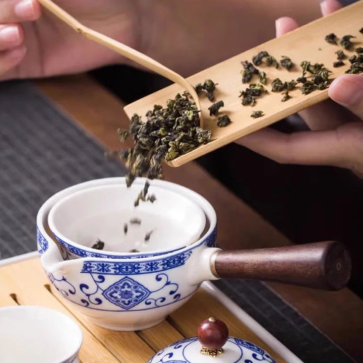 White ceramic tea maker with a built-in infuser and 360° rotation system, adding charm to your tea set.