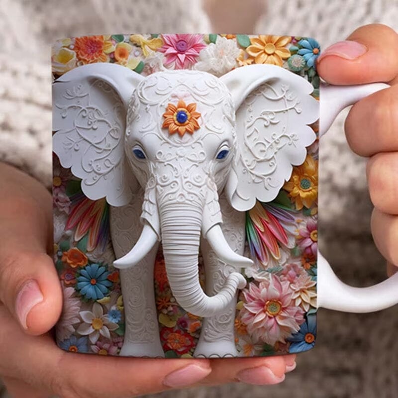 White ceramic mug with a grey elephant illustration, perfect for animal lovers. Keywords: animalprint, coffeecup, ceramicmug.
