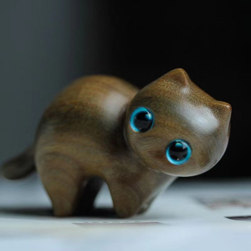 Decorative wood cat, intricately carved, makes a thoughtful gift or collectible item