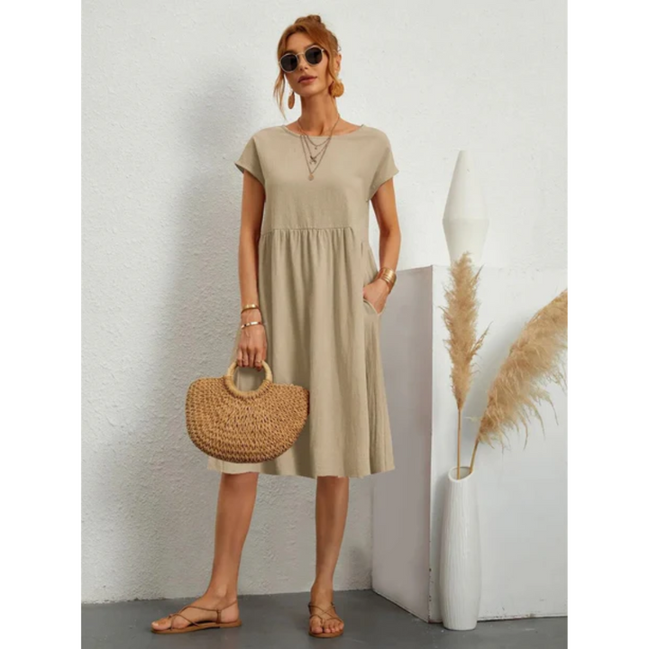 Comfortable women's cap sleeve A-line midi dress with convenient pockets, ideal for effortless summer style.