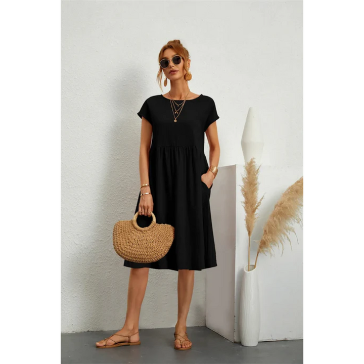 Versatile women's midi dress, A-line cut, cap sleeves & pockets. Perfect for casual elegant day wear or summer.