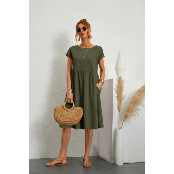 Stylish women's A-line midi dress featuring practical pockets & elegant cap sleeves for summer fashion.