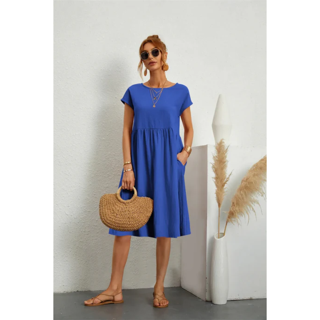 Lightweight women's summer midi dress. Cap sleeve, A-line silhouette with pockets for easy, chic wear.