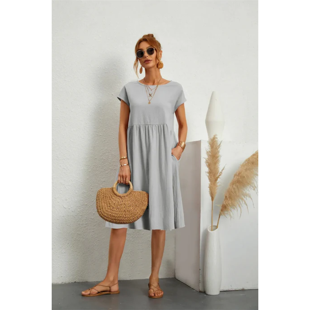 Effortless chic: women's cap sleeve A-line midi dress with pockets. A comfortable and stylish summer day dress.