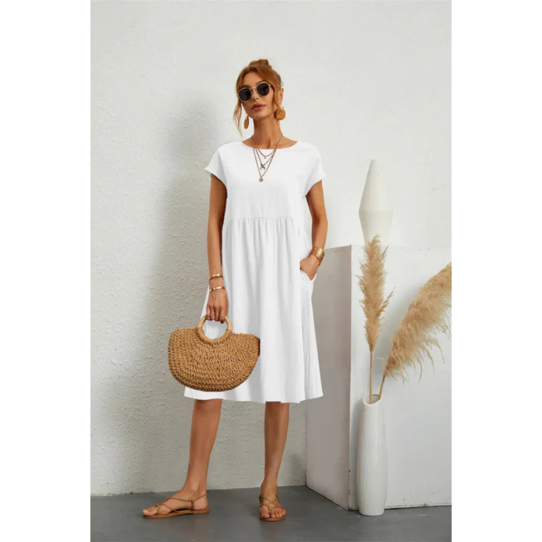 Women's comfortable A-line midi dress. Features cap sleeves & pockets, great for casual elegant summer fashion.
