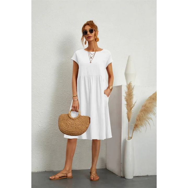 Women's comfortable A-line midi dress. Features cap sleeves & pockets, great for casual elegant summer fashion.