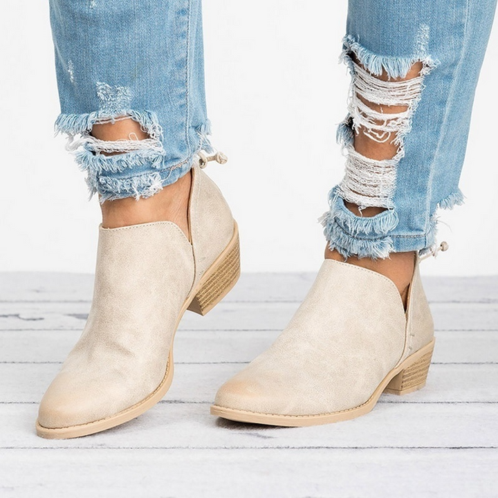 Chic women's black ankle boots with low block heel and back zipper, perfect for fall fashion.
