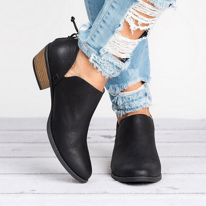 Stylish women's ankle boots featuring a comfortable low block heel and practical back zip closure.
