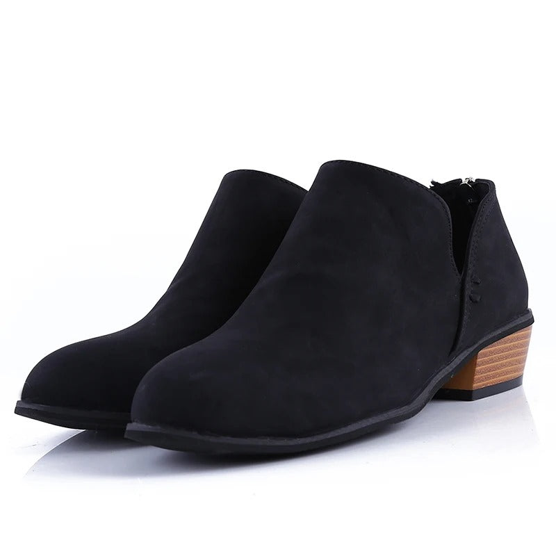 Elegant women's fall ankle boots with a sturdy low block heel and distinctive back zip detail.