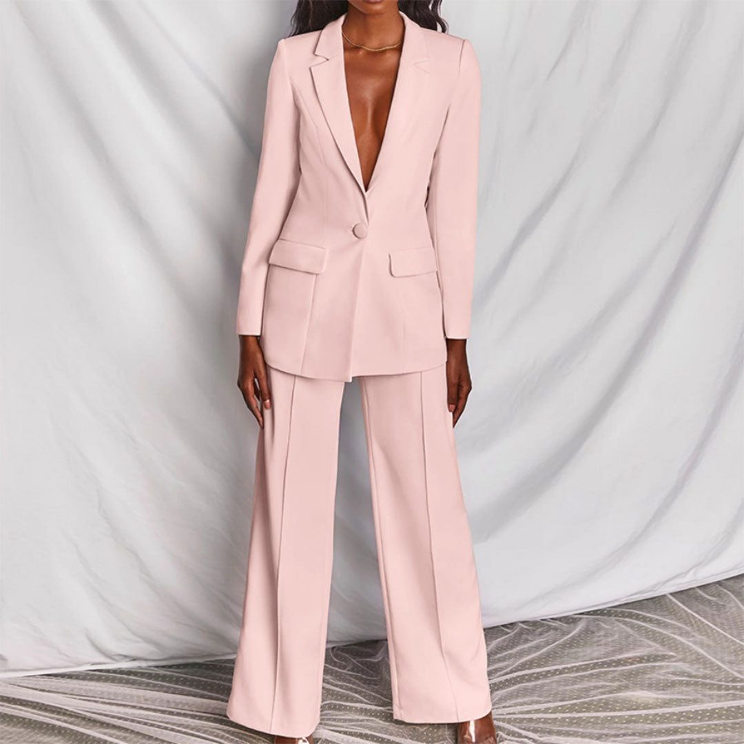 Sophisticated women's fashion blazer and high-waisted pants set. A modern tailored look for business or special occasions.