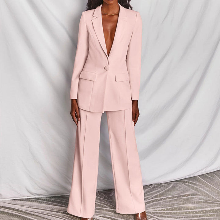 Sophisticated women's fashion blazer and high-waisted pants set. A modern tailored look for business or special occasions.