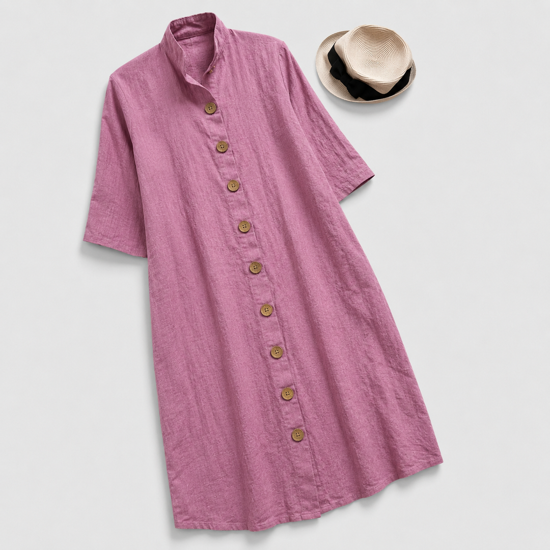 Woman in a versatile button-down shirt dress with a layered midi hem, great for all-season chic and comfort.