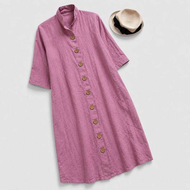 Woman in a versatile button-down shirt dress with a layered midi hem, great for all-season chic and comfort.