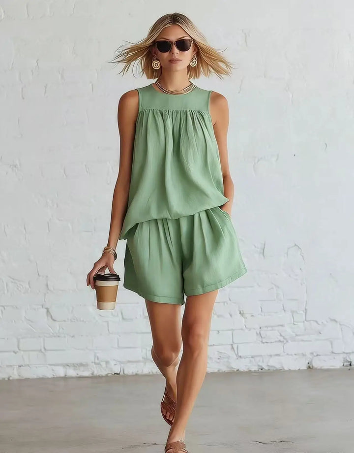 Comfortable women's two-piece lounge wear shorts set with a gathered top & high-waisted design. Vacation style.